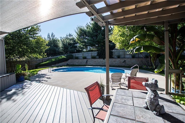 view of pool with a fenced backyard, a pergola, a deck, and a patio