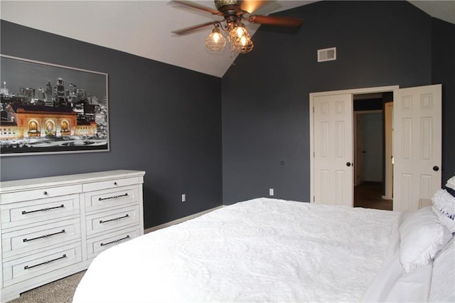 bedroom featuring carpet, a ceiling fan, vaulted ceiling, and visible vents