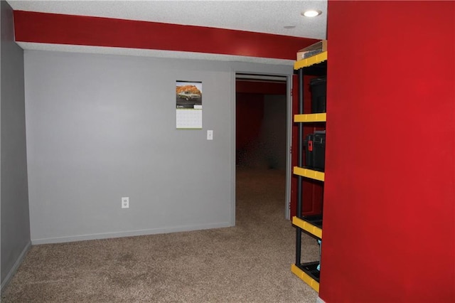 carpeted spare room with baseboards and recessed lighting