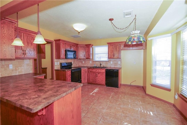 kitchen with baseboards, a peninsula, light tile patterned floors, visible vents, and black appliances