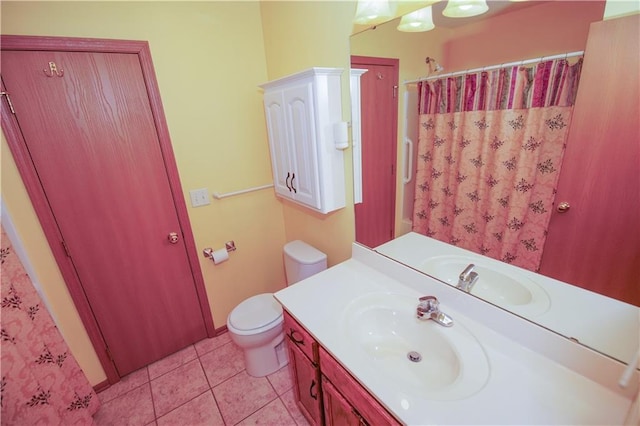 bathroom with toilet, tile patterned floors, vanity, and a shower with shower curtain