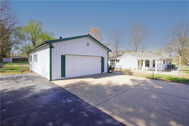 exterior space featuring central AC and fence