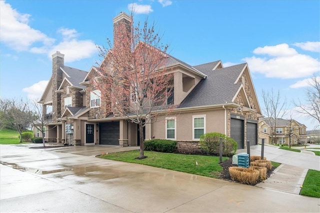 view of front of property featuring stone siding, stucco siding, driveway, a chimney, and a front yard