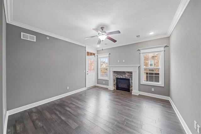 unfurnished living room featuring a textured ceiling, a ceiling fan, baseboards, dark wood-style flooring, and ornamental molding