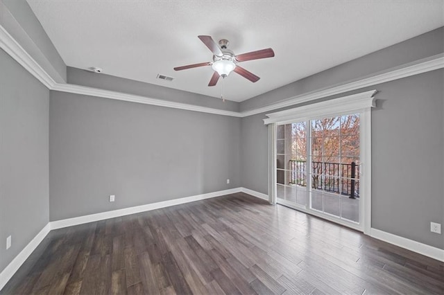 unfurnished room featuring a ceiling fan, baseboards, and dark wood finished floors
