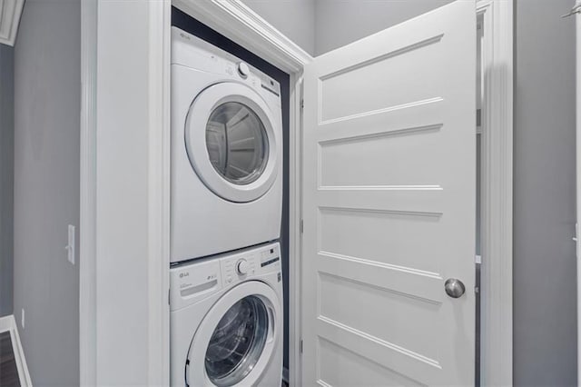laundry area with stacked washer / drying machine