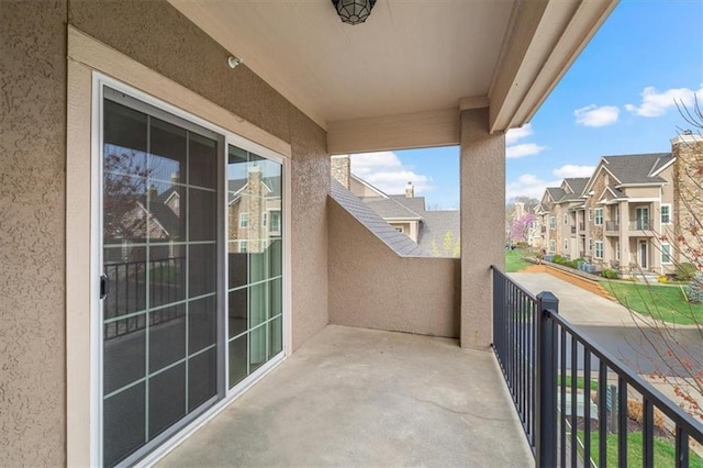 balcony featuring a residential view