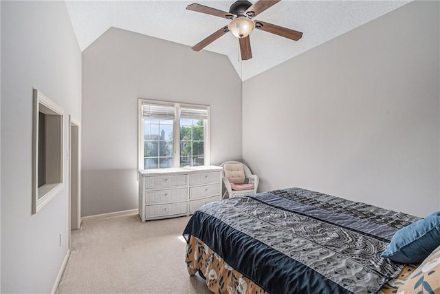 carpeted bedroom featuring vaulted ceiling, baseboards, and ceiling fan