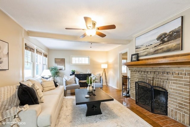 5825 Rockhill Rd, Kansas City, MO 64110 - living area featuring a fireplace, plenty of natural light, ceiling fan, baseboards, and crown molding