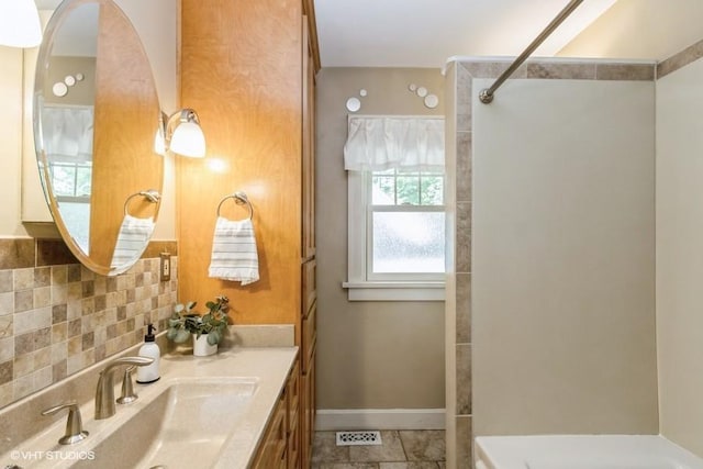 5825 Rockhill Rd, Kansas City, MO 64110 - full bathroom with vanity and tile patterned floors