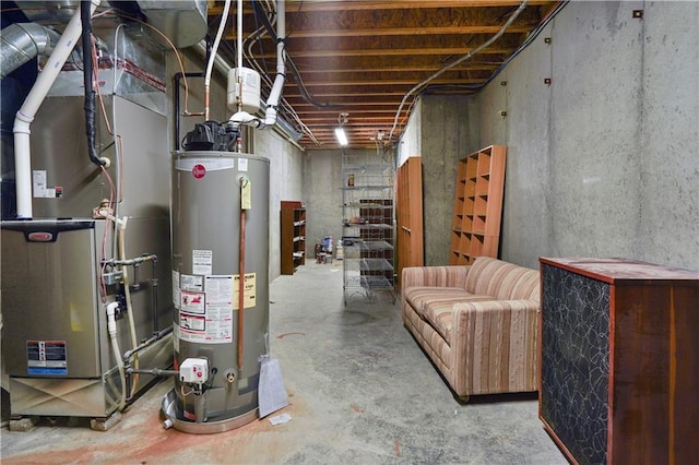 unfinished below grade area featuring gas water heater and heating unit
