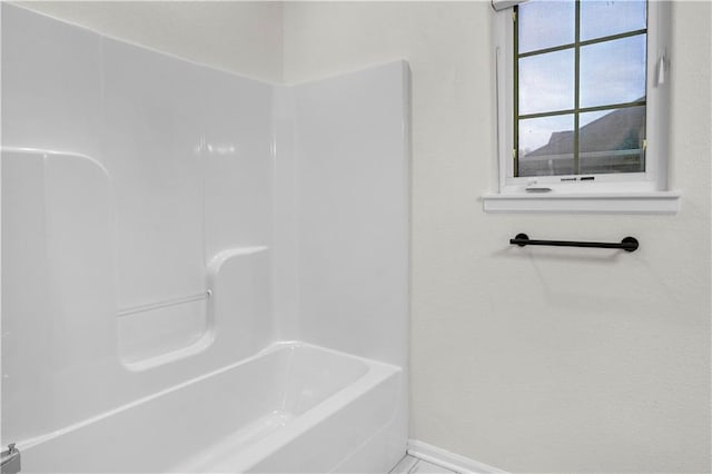 bathroom with baseboards