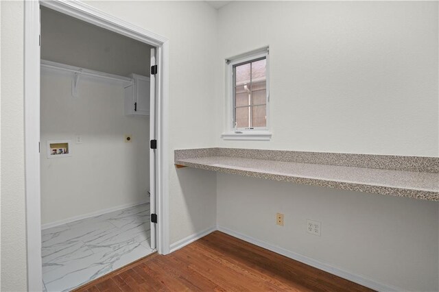 laundry room with marble finish floor, laundry area, baseboards, electric dryer hookup, and washer hookup