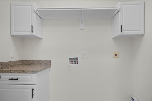 laundry area featuring cabinet space, hookup for a washing machine, and electric dryer hookup