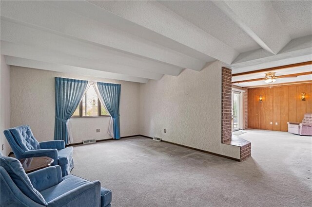 19864 211th St, Tonganoxie, KS 66086 - unfurnished room featuring plenty of natural light, beam ceiling, carpet floors, a textured wall, and a textured ceiling