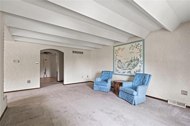 19864 211th St, Tonganoxie, KS 66086 - unfurnished room featuring carpet floors, arched walkways, beam ceiling, and baseboards
