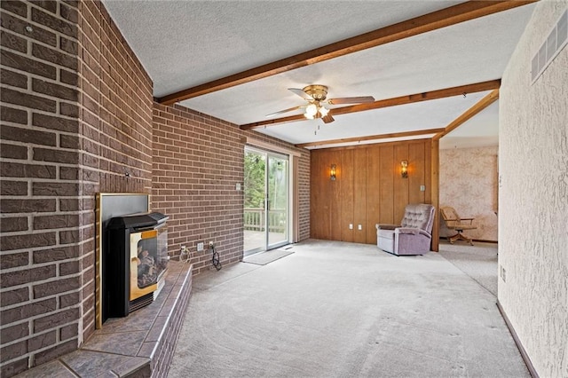 19864 211th St, Tonganoxie, KS 66086 - unfurnished room with beamed ceiling, carpet flooring, a textured ceiling, and ceiling fan