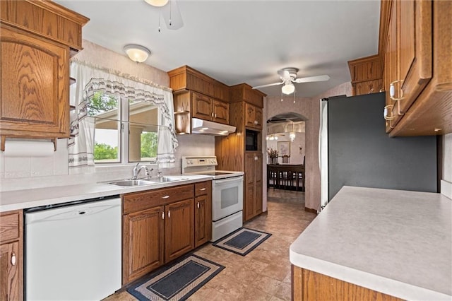 19864 211th St, Tonganoxie, KS 66086 - kitchen with white appliances, ceiling fan, under cabinet range hood, and light countertops