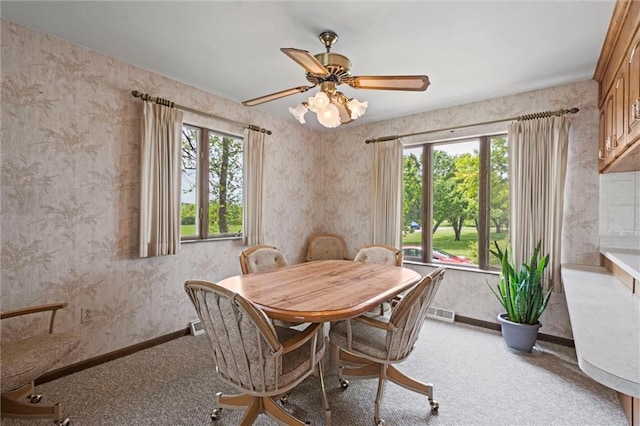 19864 211th St, Tonganoxie, KS 66086 - carpeted dining area with baseboards, a ceiling fan, and wallpapered walls