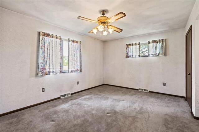 19864 211th St, Tonganoxie, KS 66086 - unfurnished room featuring carpet, a ceiling fan, baseboards, and a textured wall