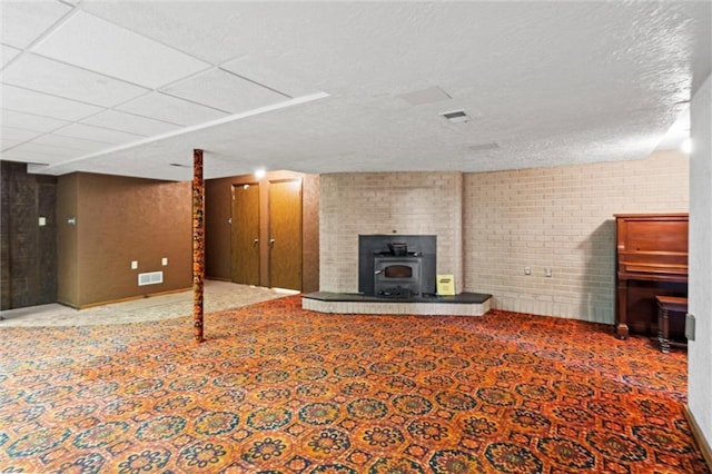19864 211th St, Tonganoxie, KS 66086 - finished basement with a wood stove and carpet
