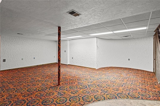 19864 211th St, Tonganoxie, KS 66086 - finished basement with a textured wall, carpet flooring, and baseboards