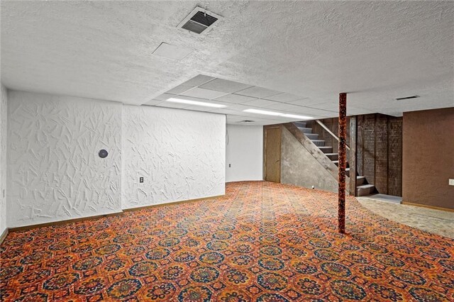 19864 211th St, Tonganoxie, KS 66086 - finished basement featuring stairway, carpet floors, and a textured ceiling
