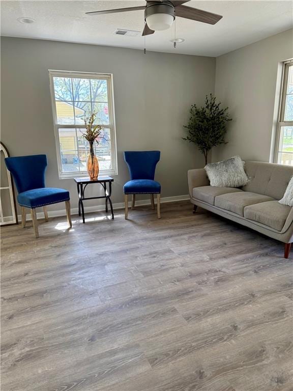 112 Benton St, Pleasant Hill, MO 64080 - sitting room with visible vents, ceiling fan, and wood finished floors
