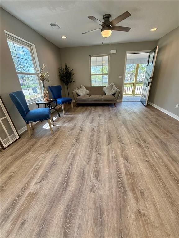 112 Benton St, Pleasant Hill, MO 64080 - living area featuring baseboards, recessed lighting, visible vents, ceiling fan, and wood finished floors