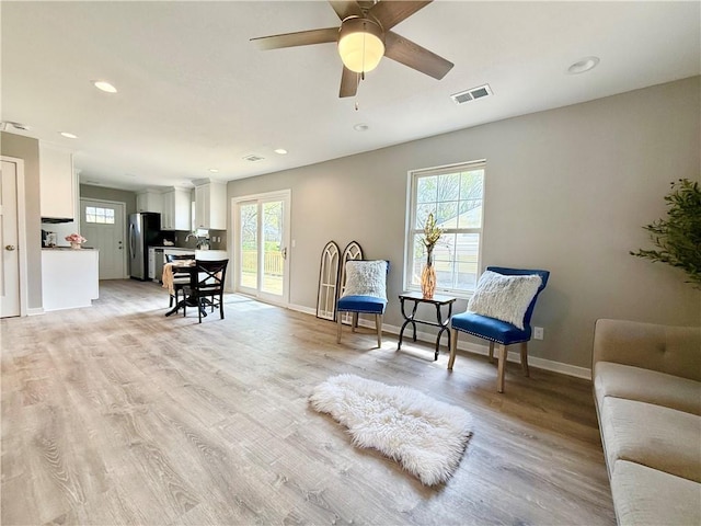 112 Benton St, Pleasant Hill, MO 64080 - sitting room with visible vents, baseboards, and a healthy amount of sunlight