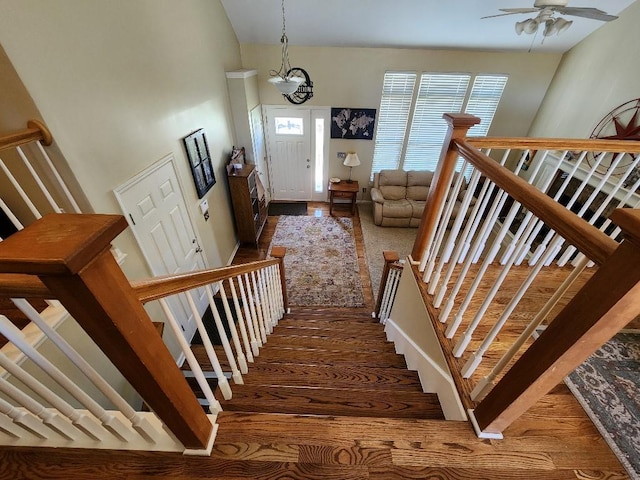 5773 Meadow Heights Dr, Shawnee, KS 66226 - staircase featuring wood finished floors and ceiling fan