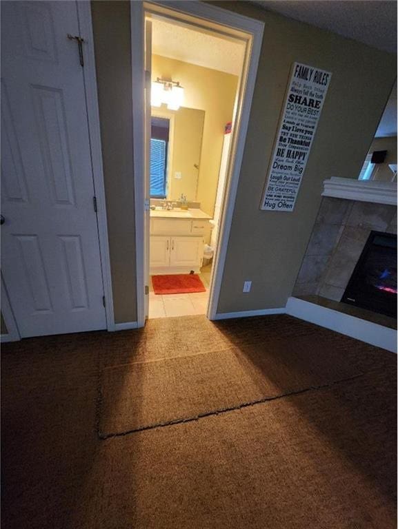 5773 Meadow Heights Dr, Shawnee, KS 66226 - hallway with baseboards, carpet, and a sink