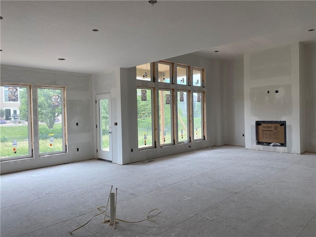 3010 NE 102nd St, Kansas City, MO 64155 - unfurnished living room with a fireplace