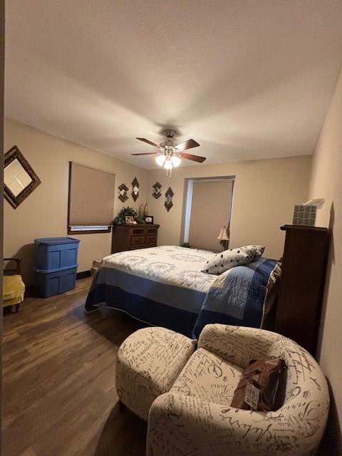 bedroom featuring ceiling fan and wood finished floors