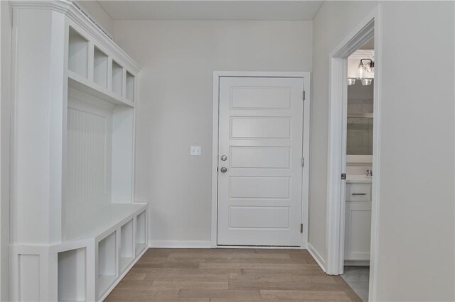 11410 S Langley St, Olathe, KS 66061 - mudroom featuring baseboards and wood finished floors