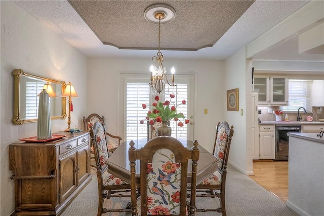 220 NW Aspen St, Lees Summit, MO 64064 - dining room with plenty of natural light, light carpet, and a textured ceiling