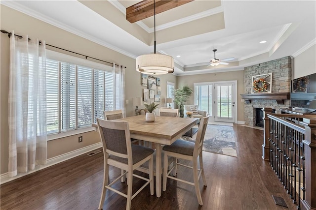11481 S Waterford Dr, Olathe, KS 66061 - dining space featuring a tray ceiling, visible vents, dark wood-style floors, and ornamental molding