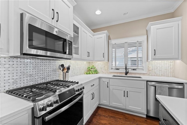 11481 S Waterford Dr, Olathe, KS 66061 - kitchen featuring crown molding, a sink, light countertops, white cabinets, and stainless steel appliances