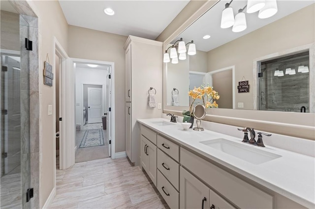 11481 S Waterford Dr, Olathe, KS 66061 - bathroom with double vanity, recessed lighting, a sink, and a stall shower