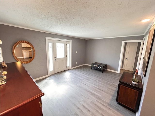 7940 Hickman Mills Dr, Kansas City, MO 64132 - foyer entrance featuring baseboards, wood finished floors, ornamental molding, and a textured ceiling