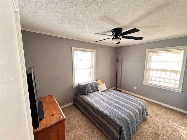 7940 Hickman Mills Dr, Kansas City, MO 64132 - bedroom with baseboards, carpet floors, ornamental molding, and a ceiling fan