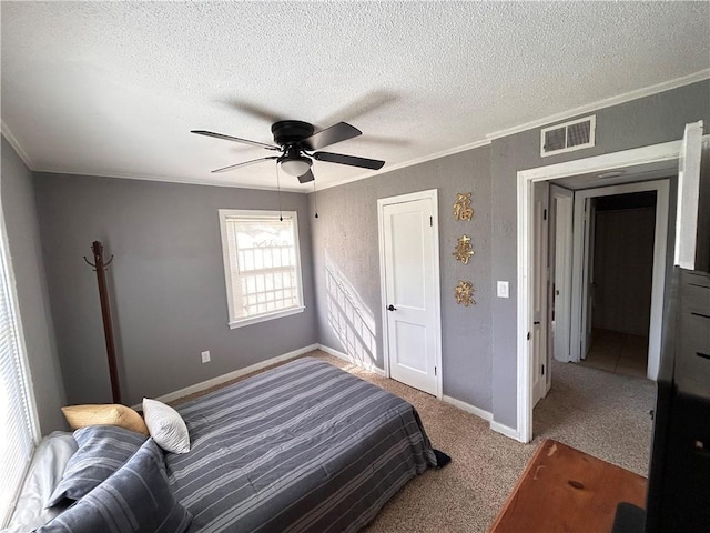 7940 Hickman Mills Dr, Kansas City, MO 64132 - bedroom featuring ornamental molding, baseboards, a textured ceiling, carpet floors, and visible vents