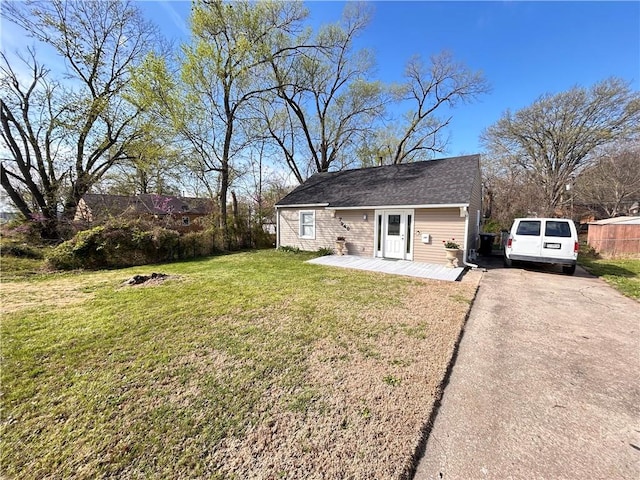 7940 Hickman Mills Dr, Kansas City, MO 64132 - back of property with driveway and a lawn