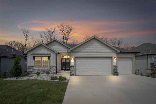2428 W 179th St, Overland Park, KS 66085 - craftsman-style house with a garage, concrete driveway, board and batten siding, stone siding, and a front yard