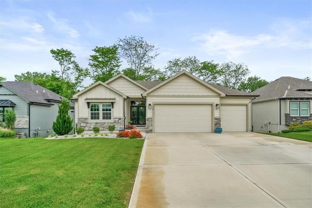 2428 W 179th St, Overland Park, KS 66085 - view of front facade featuring an attached garage, driveway, a front yard, and stone siding