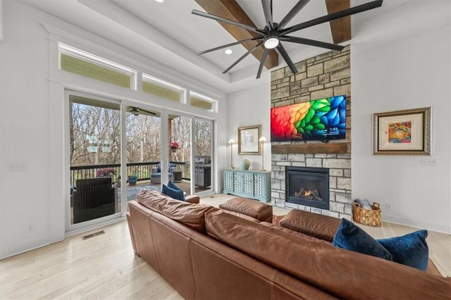 2428 W 179th St, Overland Park, KS 66085 - living area featuring a ceiling fan, a fireplace, light wood-style flooring, baseboards, and recessed lighting