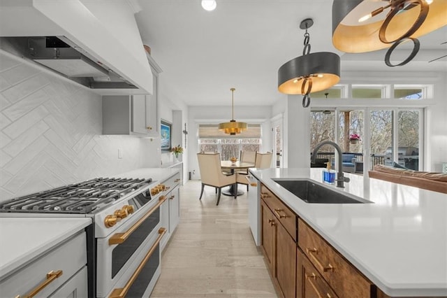 2428 W 179th St, Overland Park, KS 66085 - kitchen featuring white appliances, a sink, wall chimney exhaust hood, backsplash, and light countertops