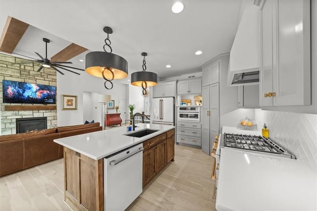 2428 W 179th St, Overland Park, KS 66085 - kitchen with white appliances, a sink, custom exhaust hood, recessed lighting, and ceiling fan