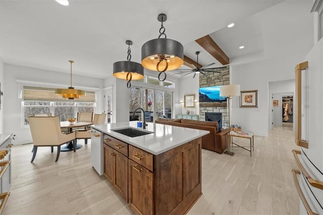 2428 W 179th St, Overland Park, KS 66085 - kitchen with a sink, a ceiling fan, white appliances, light wood-style floors, and beamed ceiling