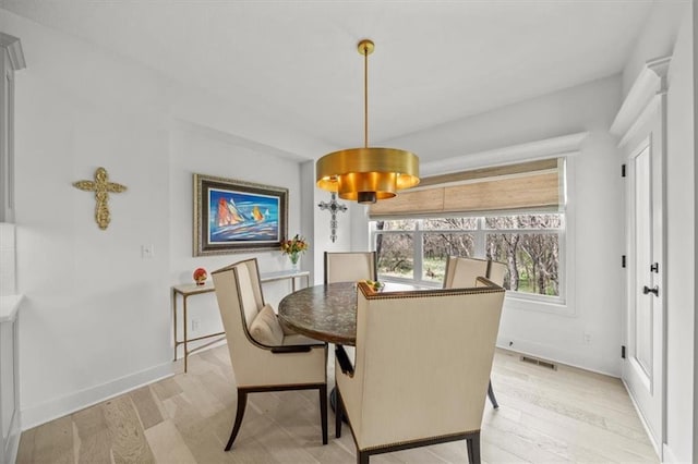 2428 W 179th St, Overland Park, KS 66085 - dining space featuring light wood-style floors and baseboards